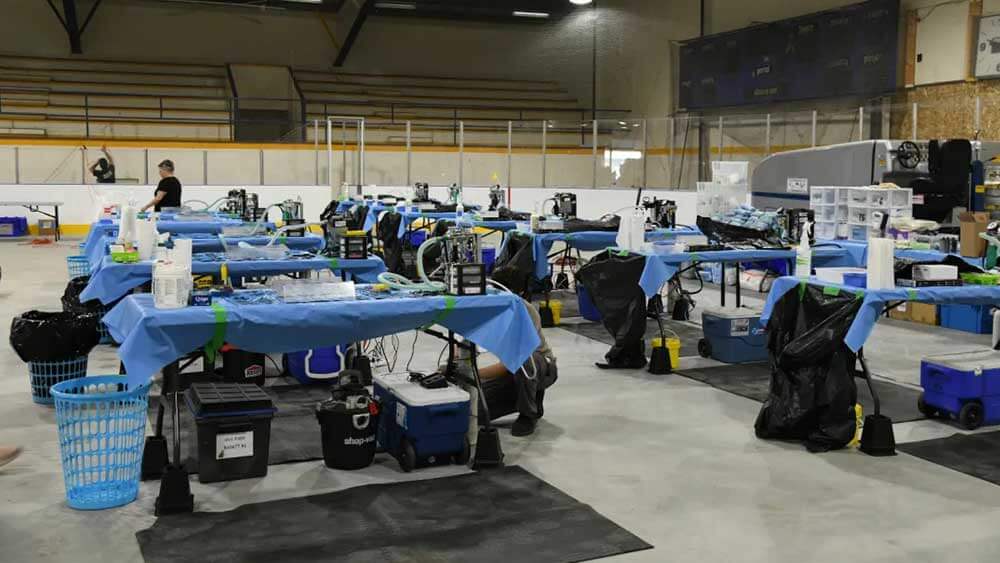 Image of vet clinic setup in hockey rink at Indigenous community of Sturgeon Lake Cree Nation in Alberta