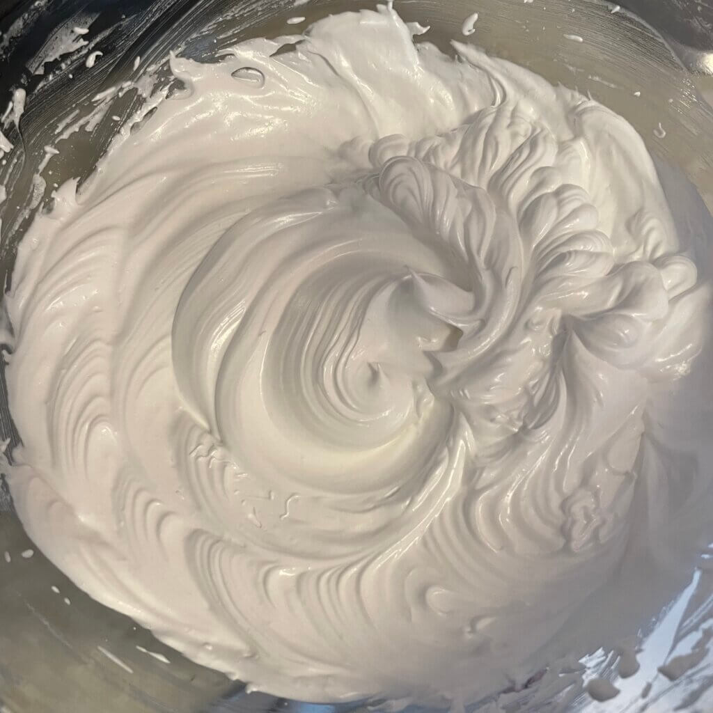 Aquafaba being whipped into a thick cream.